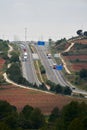 Highway with several lanes where several trucks circulate