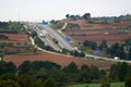 Highway with several lanes where several trucks circulate