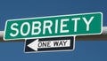 Highway sign with SOBRIETY and ONE WAY