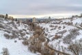 Highway on snowy mountain over Salt Lake City downtown view against cloudy sky Royalty Free Stock Photo