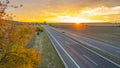 Highway at sunset in autumn evening Royalty Free Stock Photo