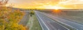 Highway at sunset in autumn evening Royalty Free Stock Photo