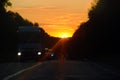 Highway during sunset, many car on road