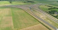 The A6 A7 Highway T-Junction, Surrounded by Green Agricultural Fields - Joure, Friesland, The Netherlands, 4K Drone Footage