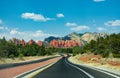 Highway to beautiful red mountains in Sedona. Royalty Free Stock Photo