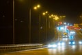 Highway traffic cars at night blured. Cars moving on road on bridge evening blurry. Royalty Free Stock Photo