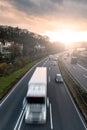 Highway traffic at sunset Royalty Free Stock Photo