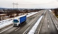 Highway transport in a snowy landscape