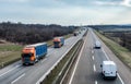 Highway Transportation traffic with Convoy of trucks passing on a highway