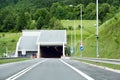 A highway tunnel cutting through a mountain