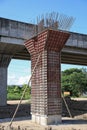 The Highway Under Construction, Concrete bridge pier with the visible traces of the framework in the bridge construction site Royalty Free Stock Photo