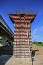 The Highway Under Construction, Concrete bridge pier with the visible traces of the framework in the bridge construction site Royalty Free Stock Photo