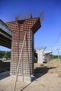 The Highway Under Construction, Concrete bridge pier with the visible traces of the framework in the bridge construction site Royalty Free Stock Photo