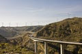 Highway under windmill scenic Royalty Free Stock Photo