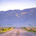 Highway with view of an immense mountain in CA