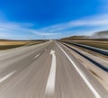 Highway with white arrow sign pointing forward Royalty Free Stock Photo
