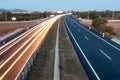 On a highway, white light trails only in one direction and there is no traffic in the opposite direction