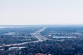 Highway winding and receding into white hazy distance. Royalty Free Stock Photo