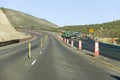 Highway workers work on state highway on Mescalero Apache Indian Reservation near Ruidoso and Alto, New Mexico