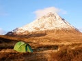 Higland in Scotland. Marvelous day at frozen river Coupall at delta to river Etive. Snowy cone of mountain