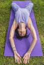 Hihg angle view of a woman lying on a yoga block to improving posture Royalty Free Stock Photo