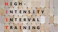 HIIT high-intensity interval training symbol. Concept words HIIT high-intensity interval training on blocks on beautiful wooden Royalty Free Stock Photo