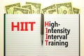 HIIT high-intensity interval training symbol. Concept words HIIT high-intensity interval training on book on a beautiful white Royalty Free Stock Photo
