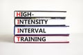 HIIT high-intensity interval training symbol. Concept words HIIT high-intensity interval training on books on a beautiful white Royalty Free Stock Photo