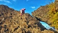 Hijab girl climbing on peak of rock mountain