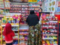 hijab girl Customer in front of cashier to pay inside Alfamart (Local Indonesia minimarket retail store