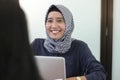 Professional young hijab muslim girl working with laptop, young muslim woman interviewing