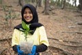 Hijab woman with new trees Royalty Free Stock Photo