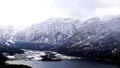 Hike epic mountains outdoor adventure and view of Hallstatt Winter snow mountain landscape and lake Royalty Free Stock Photo