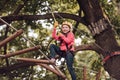Hike and kids concept. Toddler kindergarten. Eco Resort Activities. Happy child boy calling while climbing high tree and Royalty Free Stock Photo