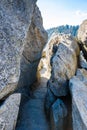 Hike on Moro Rock Staircase toward mountain top, granite dome rock formation in Sequoia National Park, Sierra Nevada mountains,