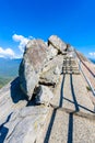 Hike on Moro Rock Staircase toward mountain top, granite dome rock formation in Sequoia National Park, Sierra Nevada mountains,