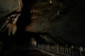 Hike to the cave. Ancient stone cave stalactites and stalagmites