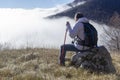 Hiker above the clouds