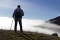 Hiker above the clouds