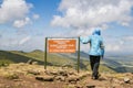 A hiker against a mountain background at the La Satima Dragons Teeth in the Aberdares, Kenya