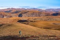 Hiker in alpine Tundra of Richardson Mountains, NWT, Canada Royalty Free Stock Photo