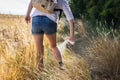 Hiker applying insect repellent against tick and mosquito in nature. Royalty Free Stock Photo