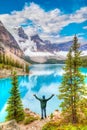 Hiker at Moraine Lake as Low Clouds Descend over the Valley of the Ten Peaks in the Canadian Rockies of Banff National Park Royalty Free Stock Photo