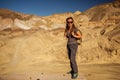 A hiker in the Artist`s Palette landmark place in Death Valley National Park, Geology, sand