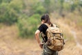 Hiker asian woman backpack walking trail activity camping outdoors for destination leisure.