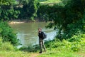 Hiker asian women walking in national park with backpack. Woman tourist going camping outdoors Royalty Free Stock Photo