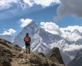 Hiker backdrop of majestic Himalayan mountains. Trekking to Everest. Nepal. Royalty Free Stock Photo