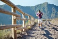 Hiker with backpack climbs on a mountain Royalty Free Stock Photo