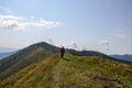 Hiker with backpack enjoying the view in Carpathian Mountains