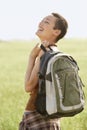 Hiker With Backpack Laughing In Field